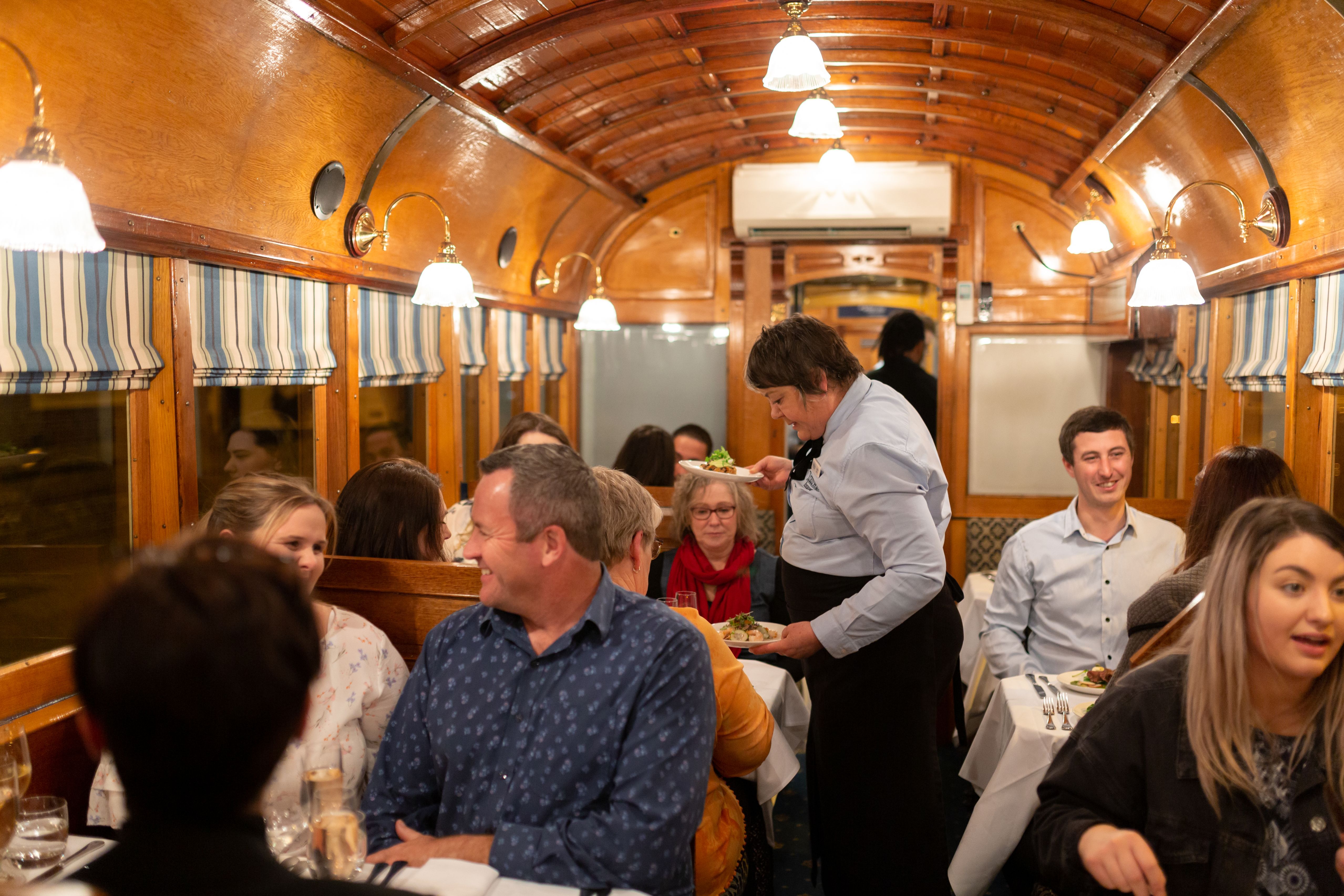 Savor every bite of exquisite local cuisine as you glide through Christchurch's streets immersed in the charm of the historic tramcar dining experience accompanied by friendly service.